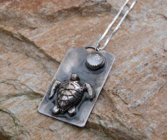 loggerhead turtle in silver going toward the light necklace