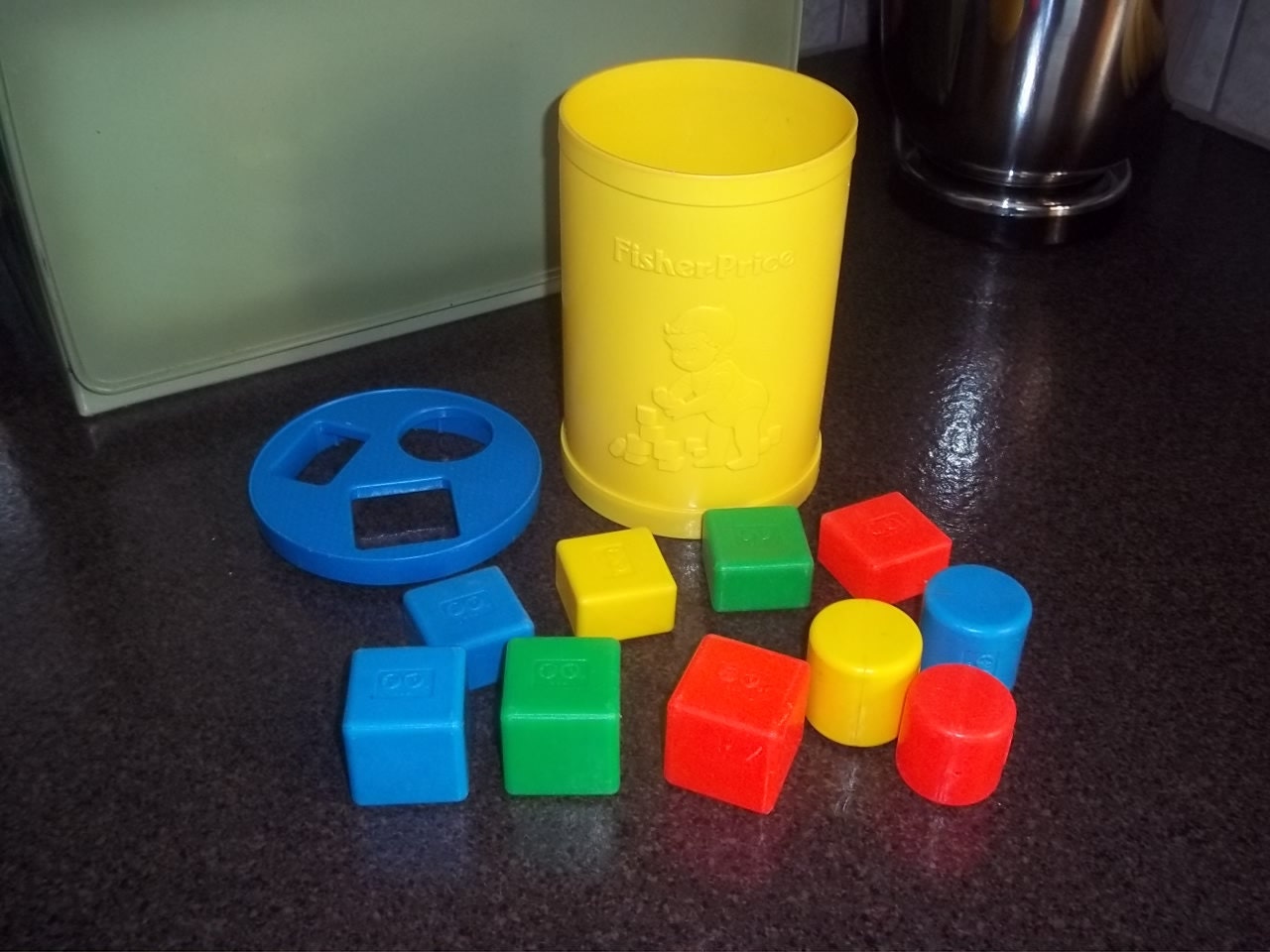 Fisher Price Shape Sorter with plastic shapes dated 1977 414