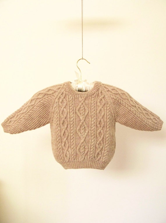 type of sweater made from thick undyed wool
