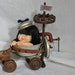 Rad Roller OOAK assemblage doll has a vintage handmade race car from found objects