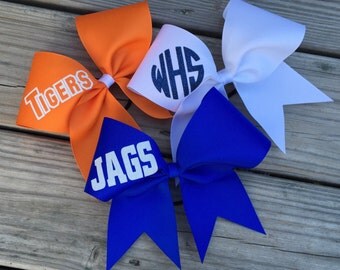 Ribbon custom cheer bows with your name/team name in glitter.