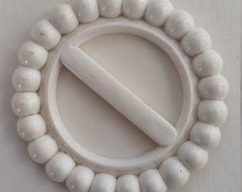 Ornate White plastic belt buckle