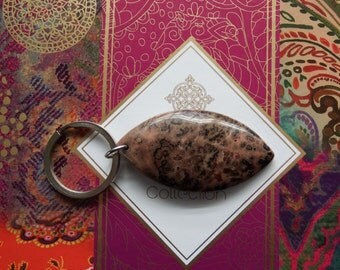 Unique keyring. Leopard-spot agate stone on stainless steel ring. Muted pink, with brown and black markings. Unusual. One of a kind.
