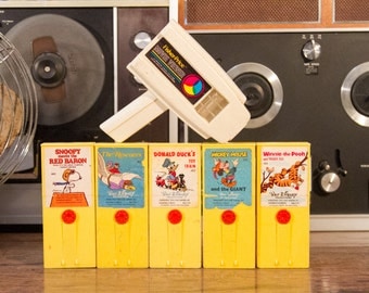 Fisher Price Movie Player with Movie Cartridges - Snoopy, Disney ...