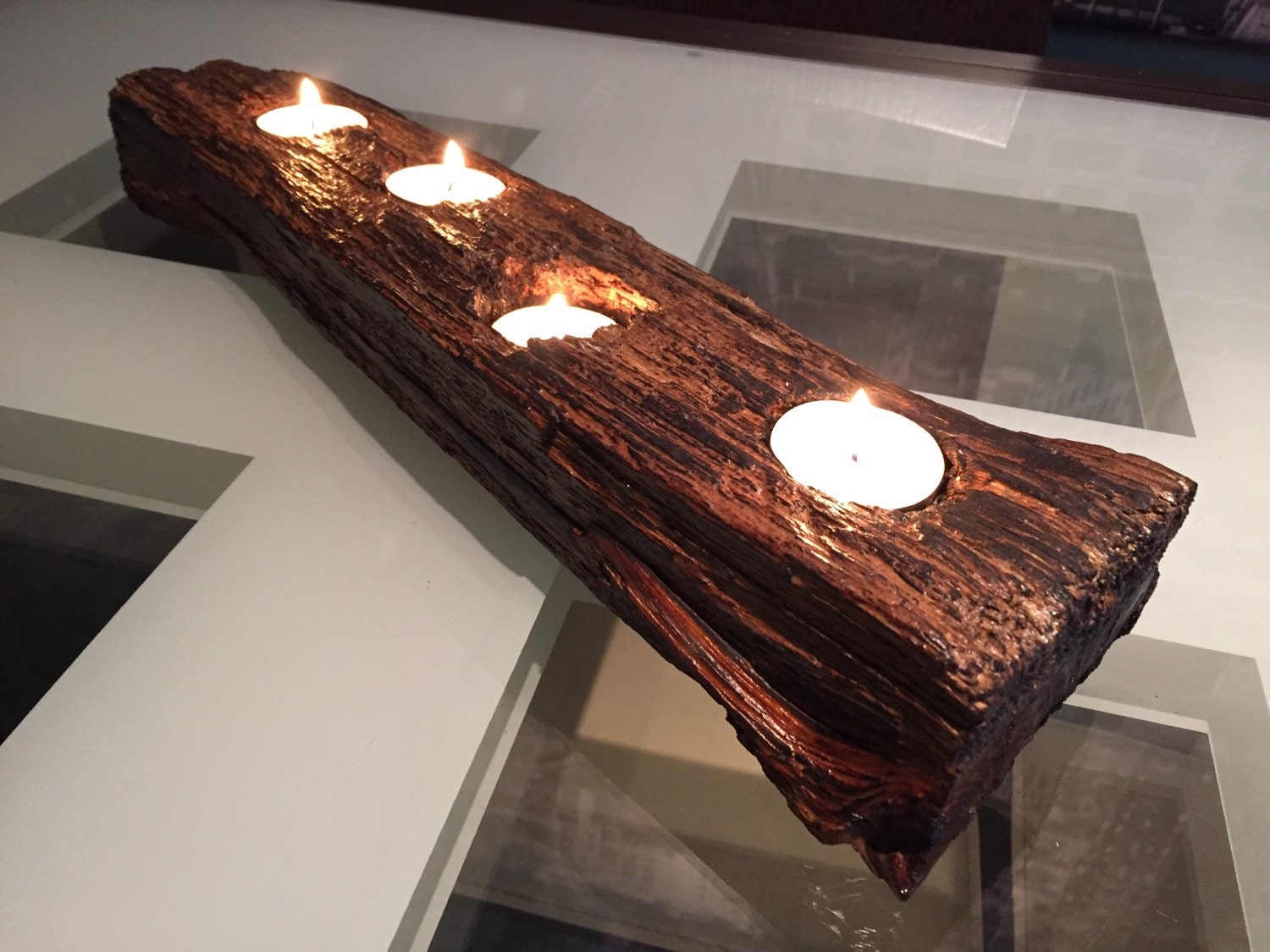Natural wood log candle holder. This piece holds four