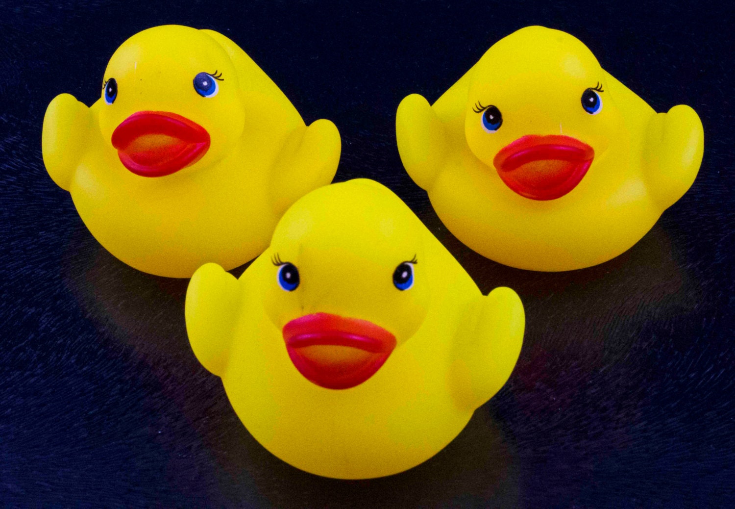 100 tiny rubber ducks