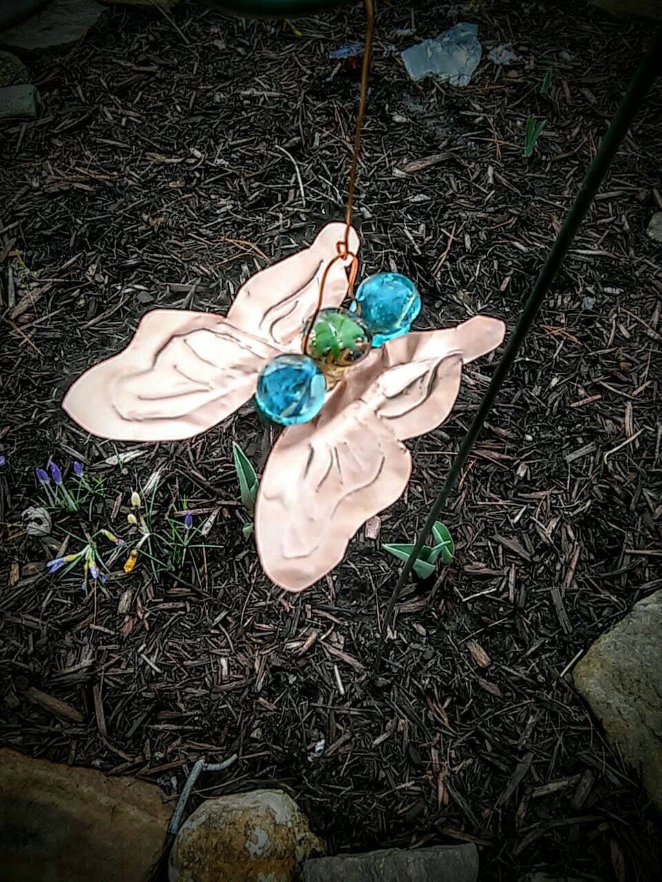 Butterfly garden ornament of copper and glass adds interest to your