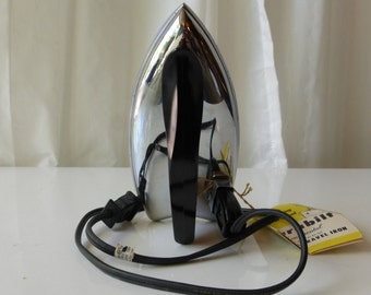 Vintage 1950's Model 506 Durabuilt electric foldable travel iron.