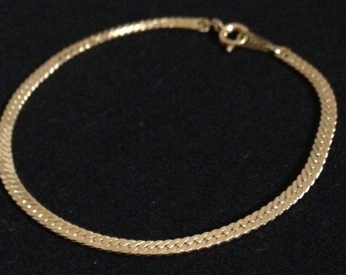 Storewide 25% Off SALE Vintage Gold Tone Woven Herringbone Style Designer Bracelet Featuring Fish Eye Clasp Closure Design