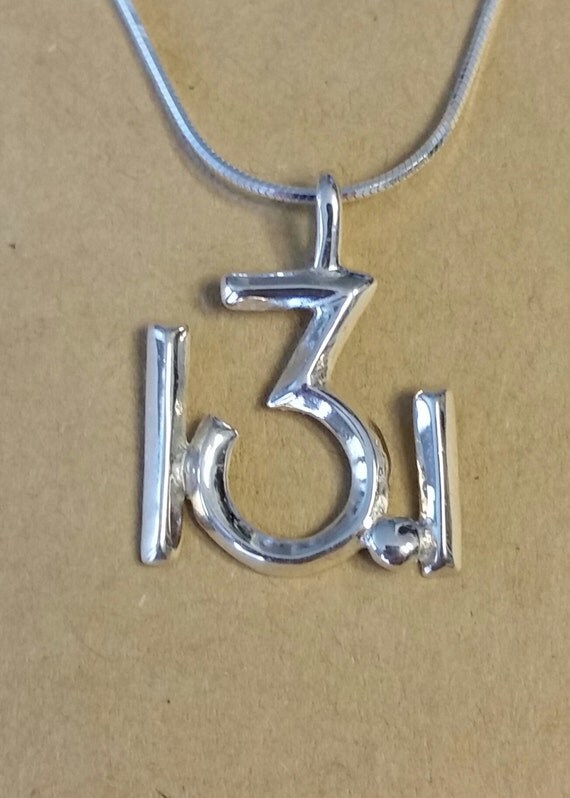 13.1 Half Marathon symbol in Sterling Silver with chain.