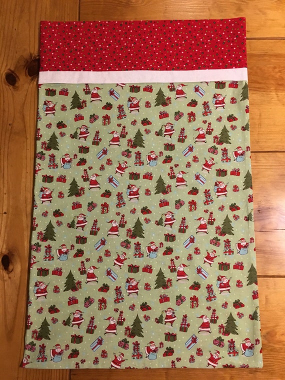 Handmade christmas pillowcase featuring Santa presents and