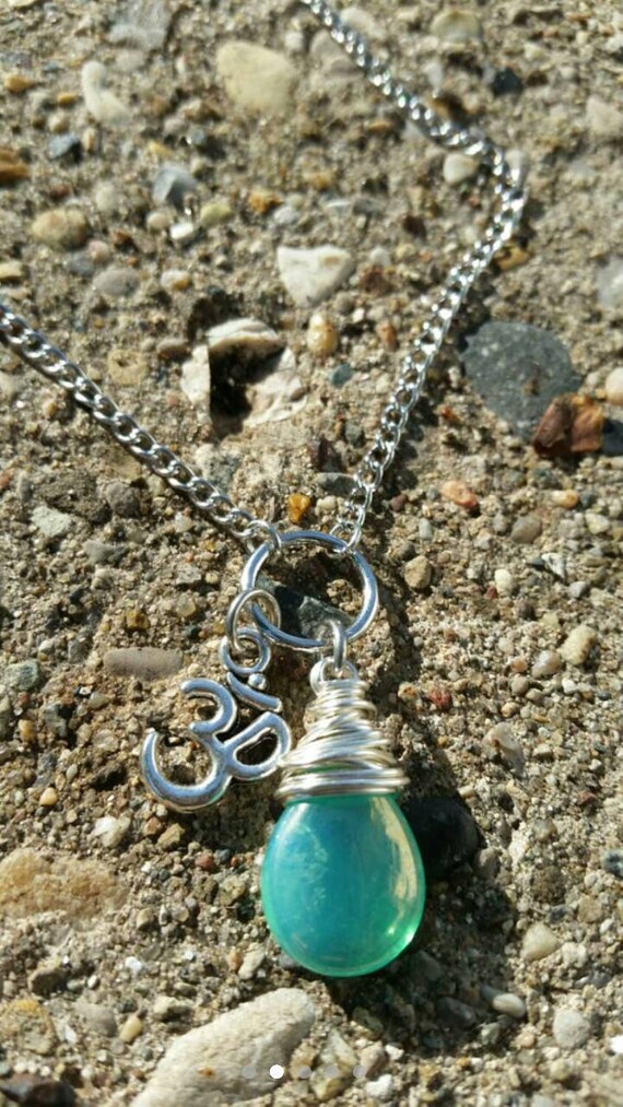 Aqua wire wrapped Ohm charm necklace. Yoga Jewelry.