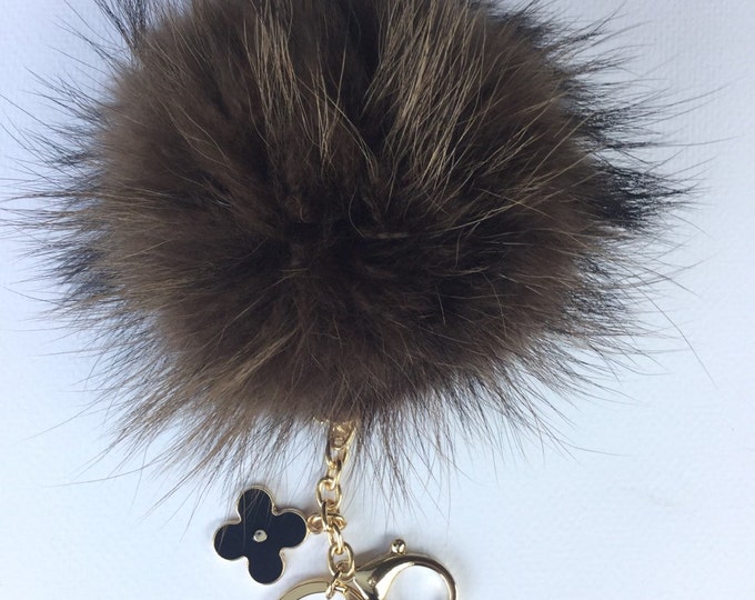 Brown with natural markings Raccoon Fur Pom Pom luxury bag pendant + black flower clover charm keychain