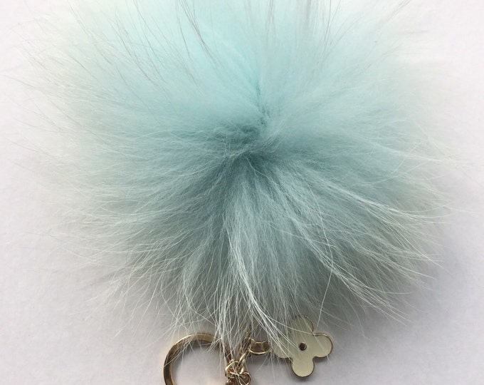 Very Light Blue with natural markings Raccoon Fur Pom Pom luxury bag pendant + black flower clover charm keychain