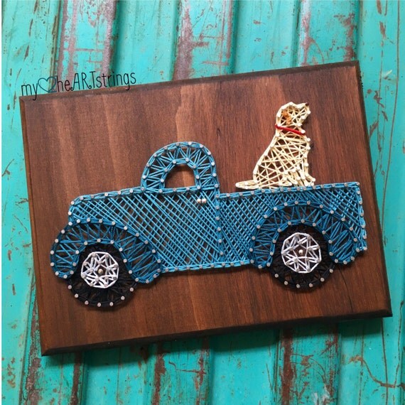 String art pup in truck