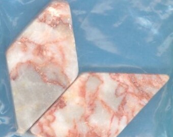 Redline marble beads, elongated diamond shape.
