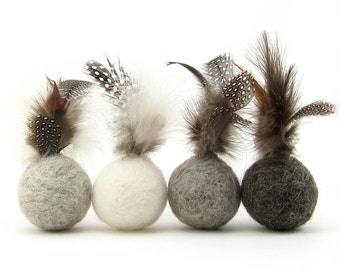 Feather ball cat toy made from wool in neutral colours