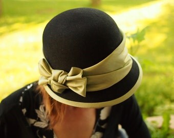 Black felt hat with green satin