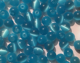 100 x 6mm Light blue cats eye beads