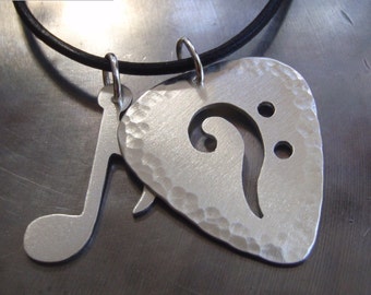 sterling Music note and bass clef charm necklace in guitar pick shape