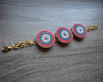 Turquoise, white, and coral circle bracelet