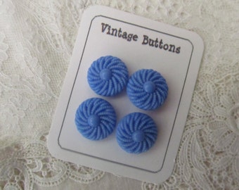 Lovely vintage blue glass buttons in a swirling design