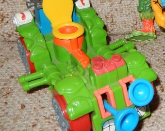 Vintage Set of 4 Teenage Mutant Ninja Turtle Action Figures with Toilet Taxi