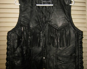REDUCED..LOWEST PRICE.....Black Leather Fringed Vest, Rebel Ryder Size "S", Quilted Lining, Laced Sides, Pieced Leather