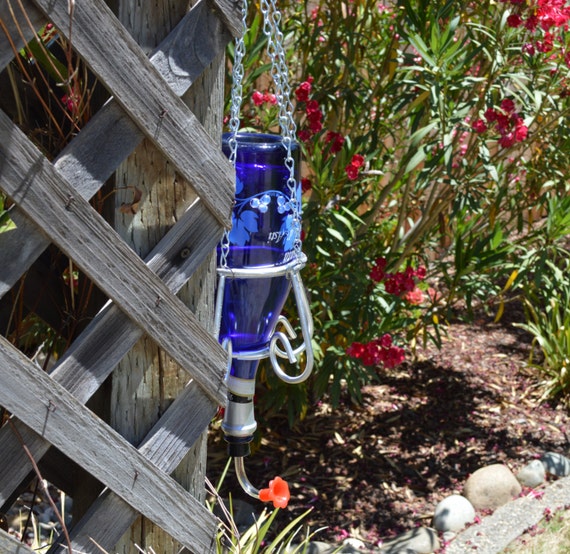 blue glass hummingbird nectar feeder bottle with silver metal blue glass hummingbird nectar feeder bottle with silver metal