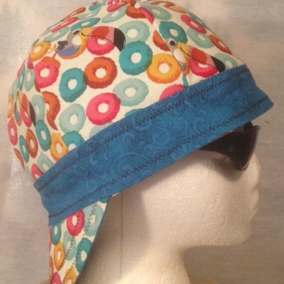 Reversible weld cap/hard hat liner with twoinch band