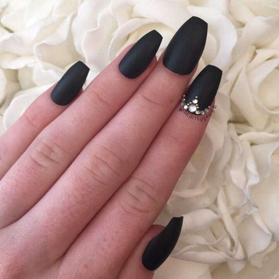 Matte black coffin nails with rhinestones and by nailartbygeorgia
