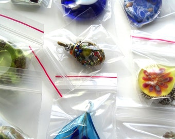 Glass pendant lot salvaged from broken jewelry.
