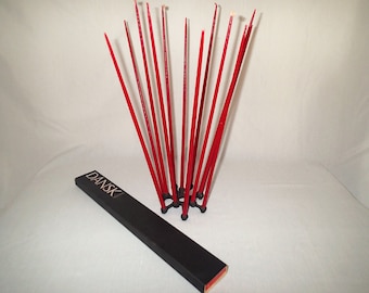 Dansk Candles Spider Tiny Taper Holder by Jens Quistgaard With 2 boxes of 15" Hand dipped Tiny Taper candles in red and gold.