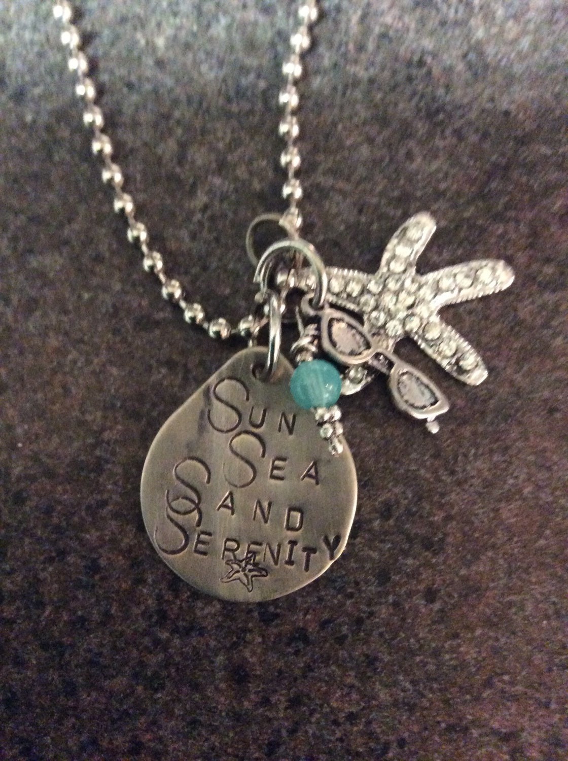 Stamped Sun Sea Sand Serenity necklace 