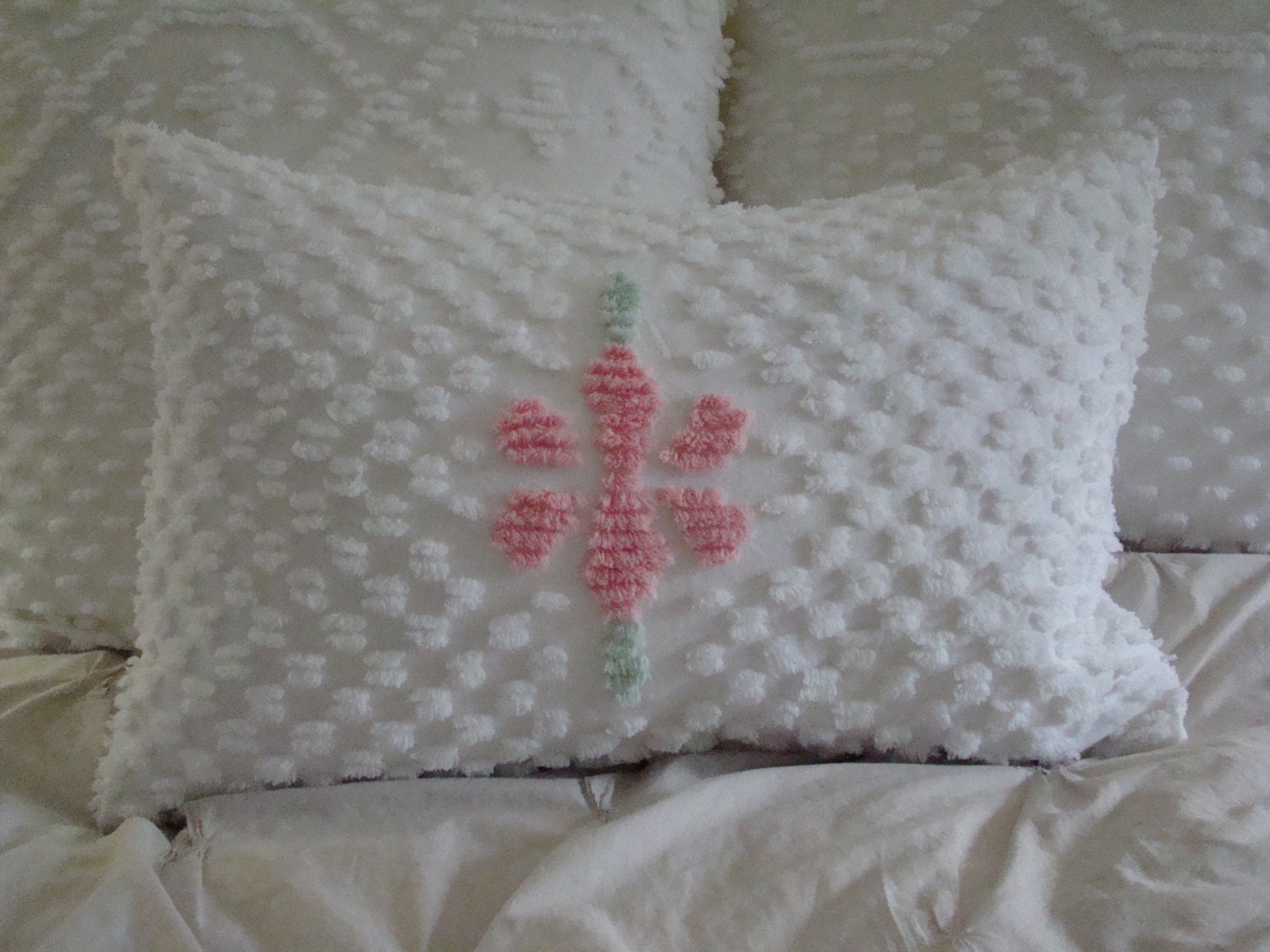 White Tufted Chenille Pillow Cover With A Pink Flower Center