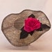 Stunning handmade gunmetal coloured contrast hat decorated with a large hot pink rose