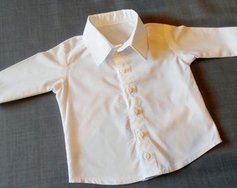 Infant or Toddler long sleeve, white dress shirt. White button down shirt in sizes NB-3 months, S, M, L, and XL. Also available in black.