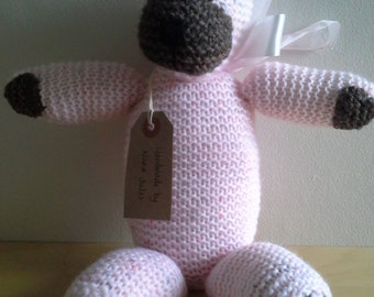 Pink and brown teddy with ribbon.