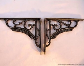A pair of beautiful antique style J Duckett & Son cast iron shelf brackets