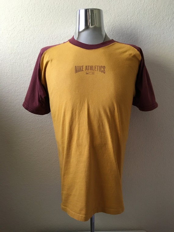 mustard yellow nike shirt