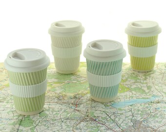 Coffee cup or ceramic travel mug with lid. White porcelain cups. Ceramic travel cups for use as a tea cup, coffee cup or succulent planter.