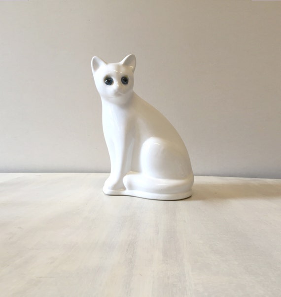 white ceramic cat figurine