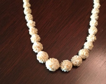 Asian carved necklace
