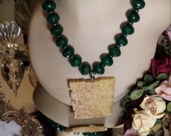 Large faceted jade beaded necklace with jade center drop