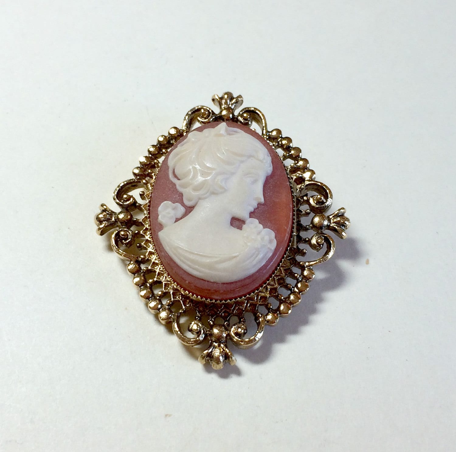 Unusual vintage cameo pin or cameo brooch from Avon perfume