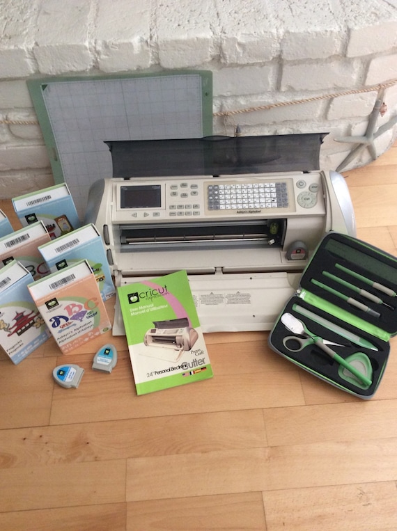 Cricut Expressions Machine with 9 cartridges.