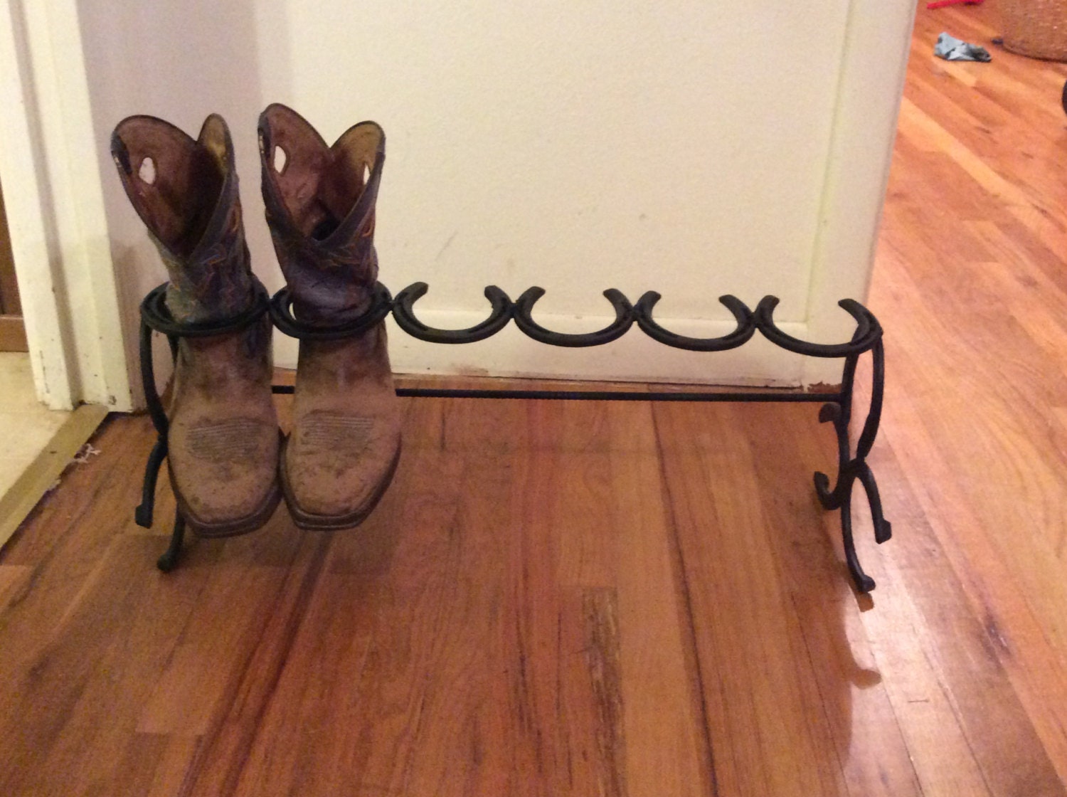 Horseshoe boot rack