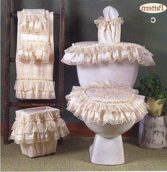 Bathroom dec. seat cover and 3 piece towel set. Will fit