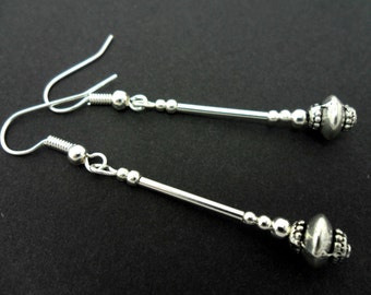 A pair of hand made tibetan silver dangly earrings.
