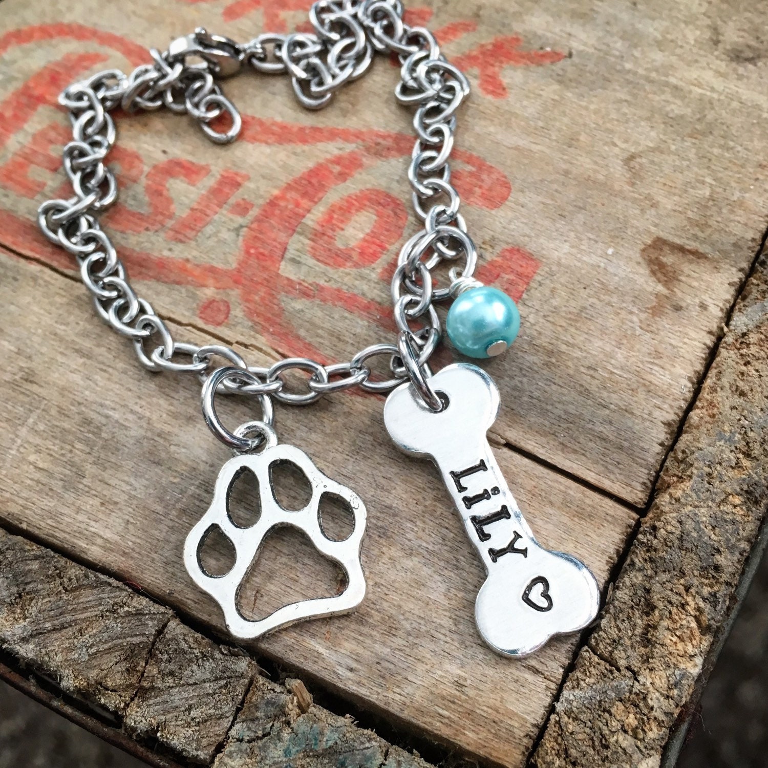 Dog bone and paw print charm bracelet with birthstone pearl